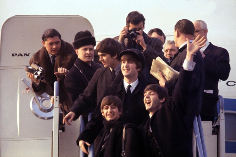 The Beatles arrive in the U.S. and 1964. Photo courtesy of Apple Corps, Ltd.
