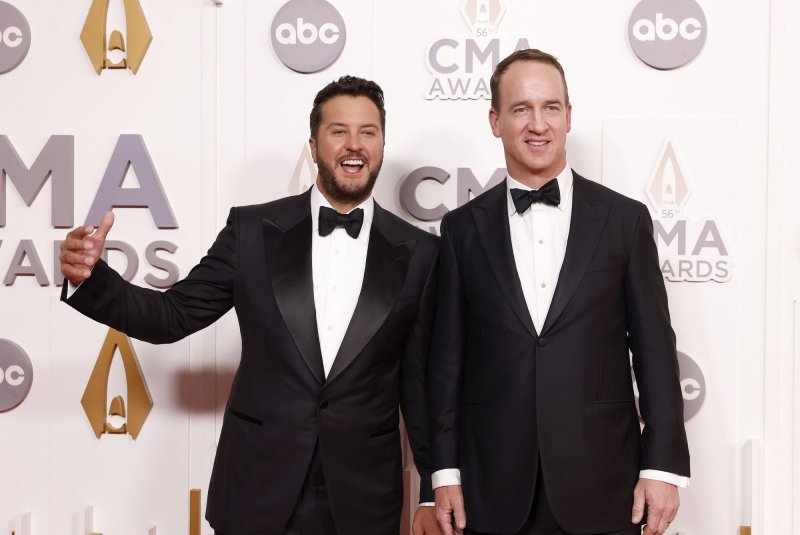 Luke Bryan (L) and Peyton Manning will co-host the CMA Awards with Lainey Wilson. File Photo by John Angelillo/UPI