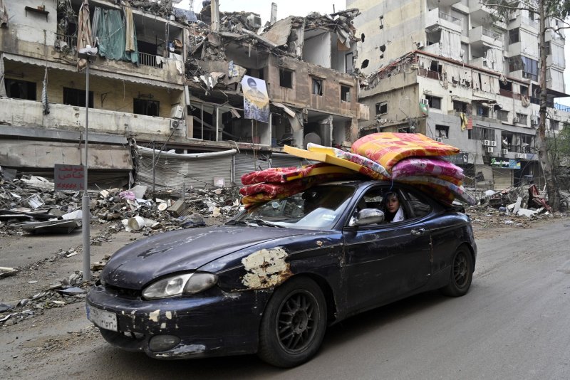 A car carrying displaced people back to their homes heads out of Beirut early Wednesday just hours after an Israel-Hezbollah cease-fire came into force. Photo by Wael Hamzeh/EPA-EFE
