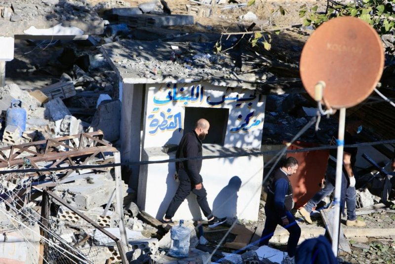 Officials inspect a Lebanese army post Wednesday that was targeted by an Israeli military strike in Sarafand, southern Lebanon, a day earlier. According to the Lebanese army command, three Lebanese servicemen were killed and at least 17 others injured, including civilians living nearby. Photo by EPA-EFE